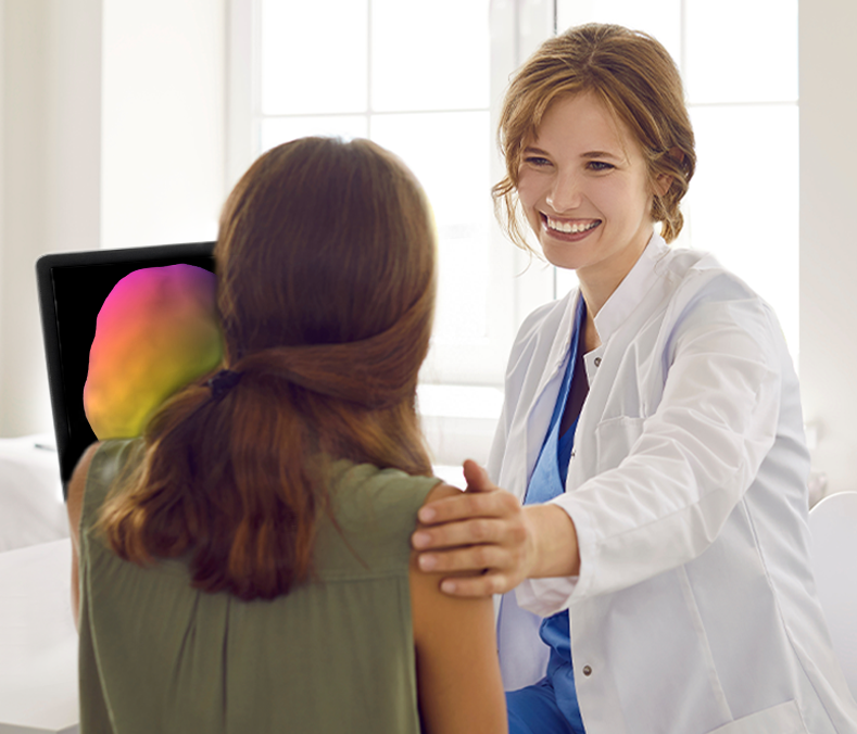 Doctor in white coat speaking with patient in a modern clinic